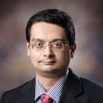 Dr. Monish De
